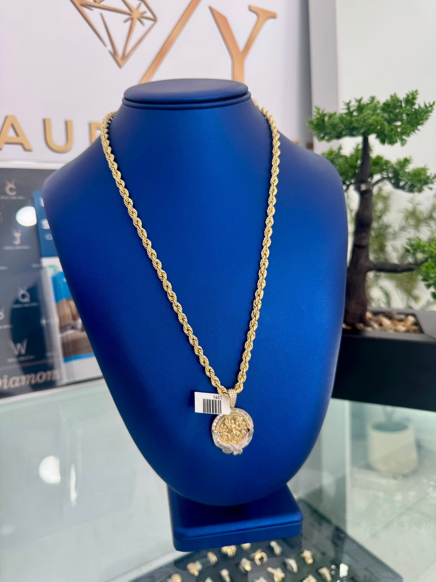 twisted chain with a centennial gold pendant